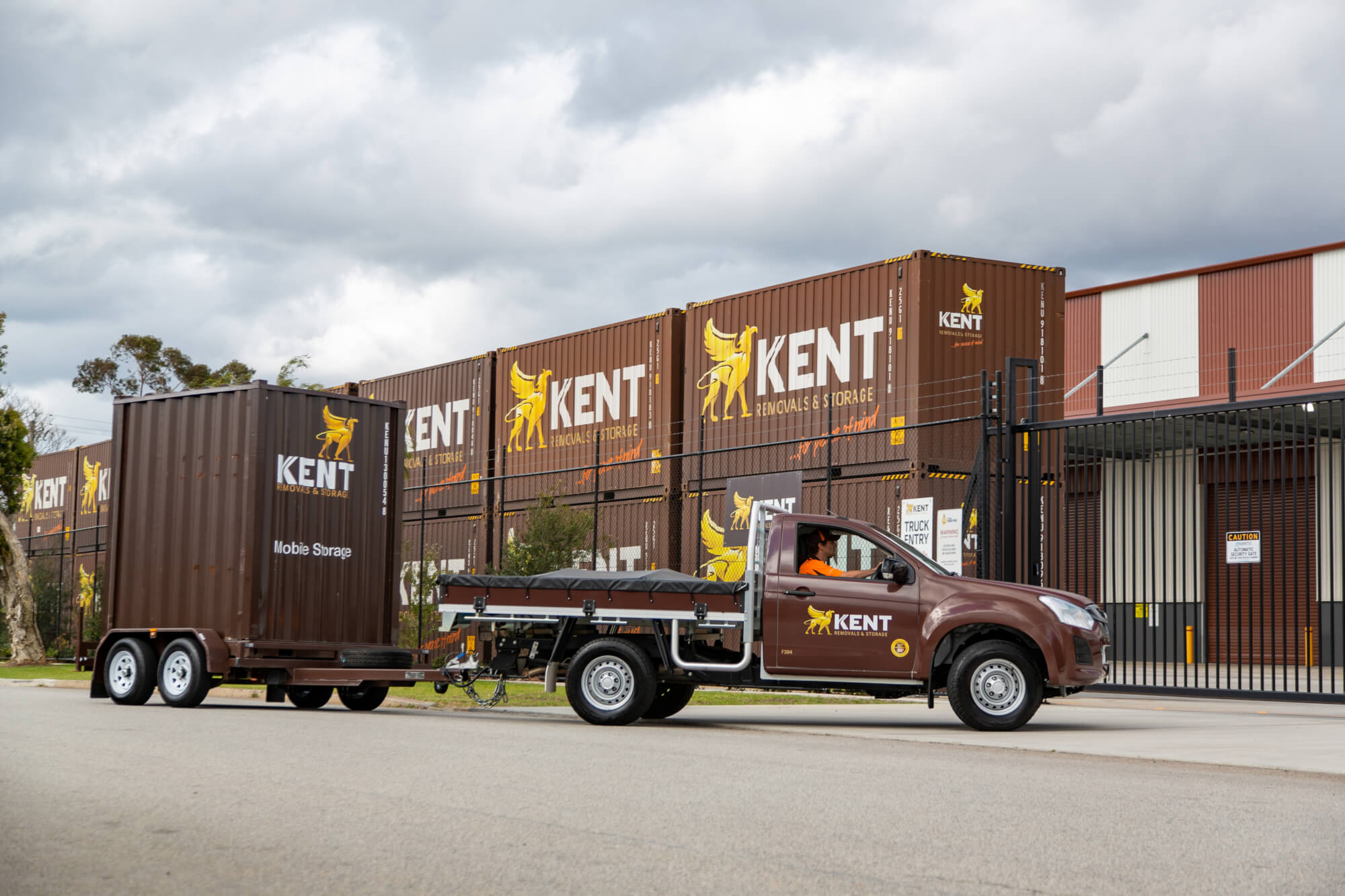 Kent Removals mobile storage container being transported outside secure storage facility