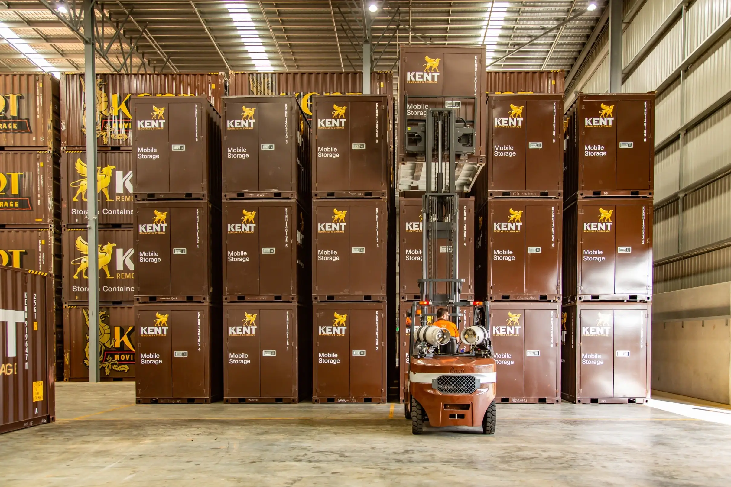 Kent Removals storage containers stacked in secure warehouse facility
