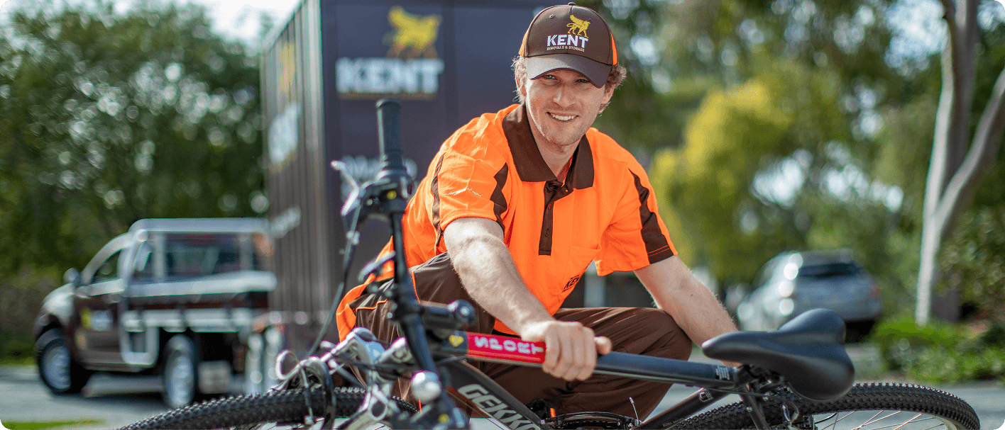 Kent Removals staff transporting bicycle during residential moving service