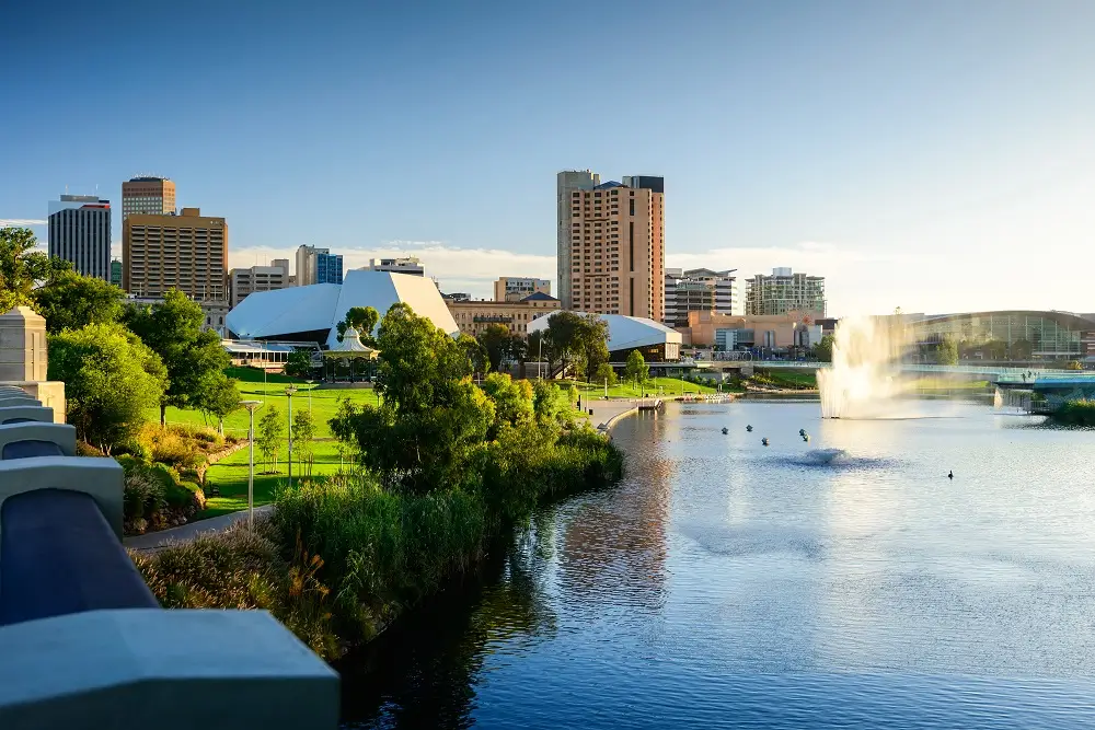 Adelaide city skyline with River Torrens fountain and Elder Park