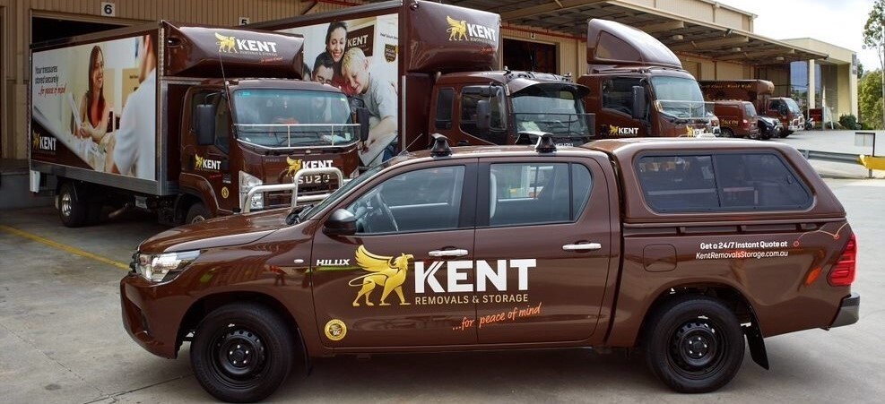 Kent Removals trucks and service vehicles at relocation warehouse facility