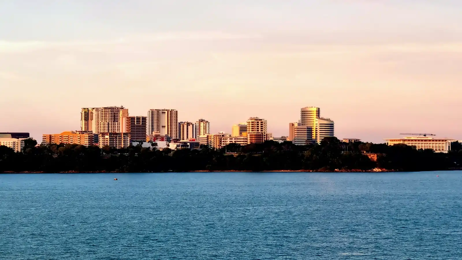 Darwin city skyline viewed from the harbor at sunset