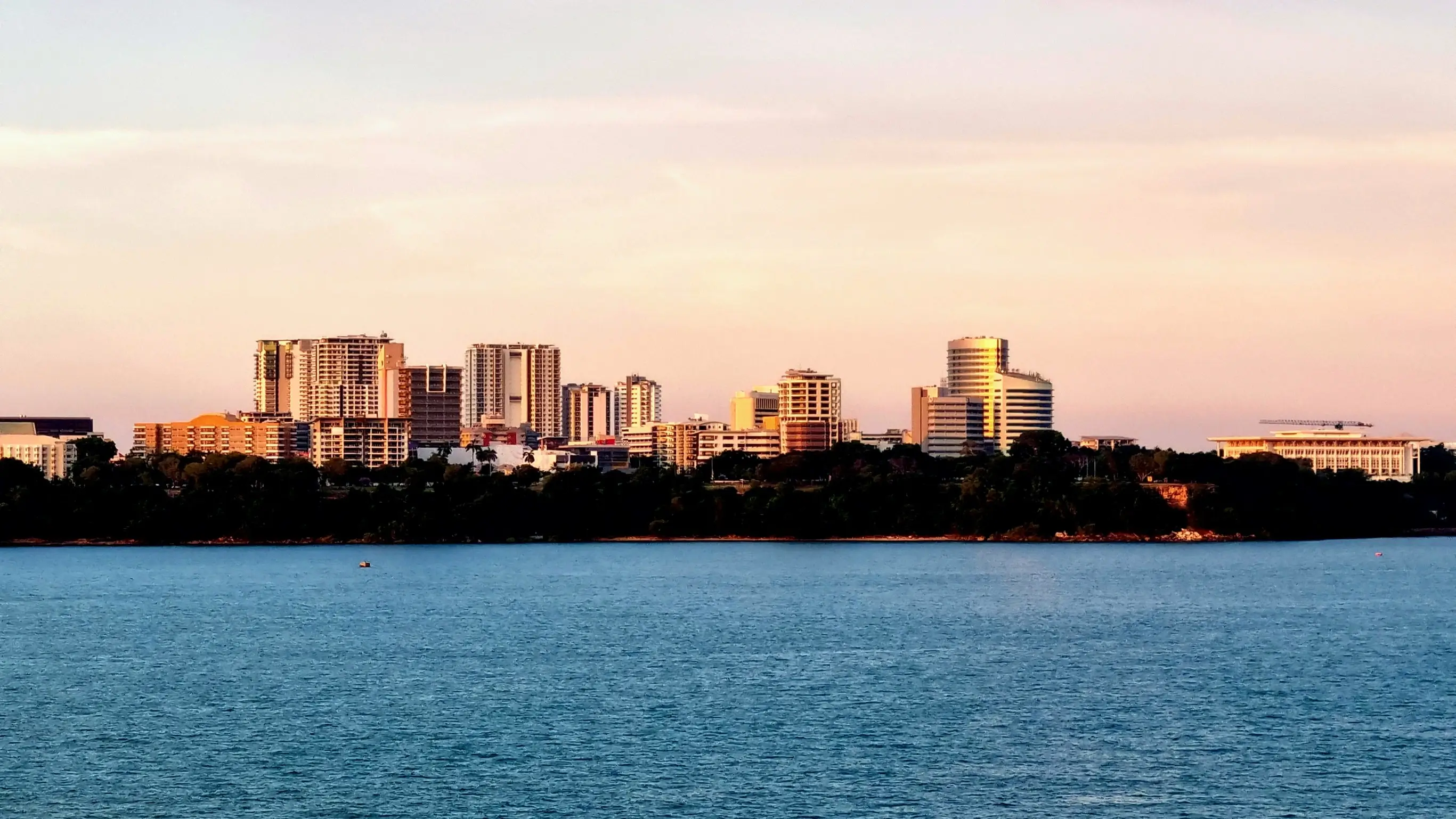 Darwin city skyline viewed from the harbor at sunset