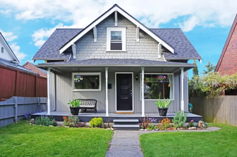 Suburban house exterior with front porch and garden