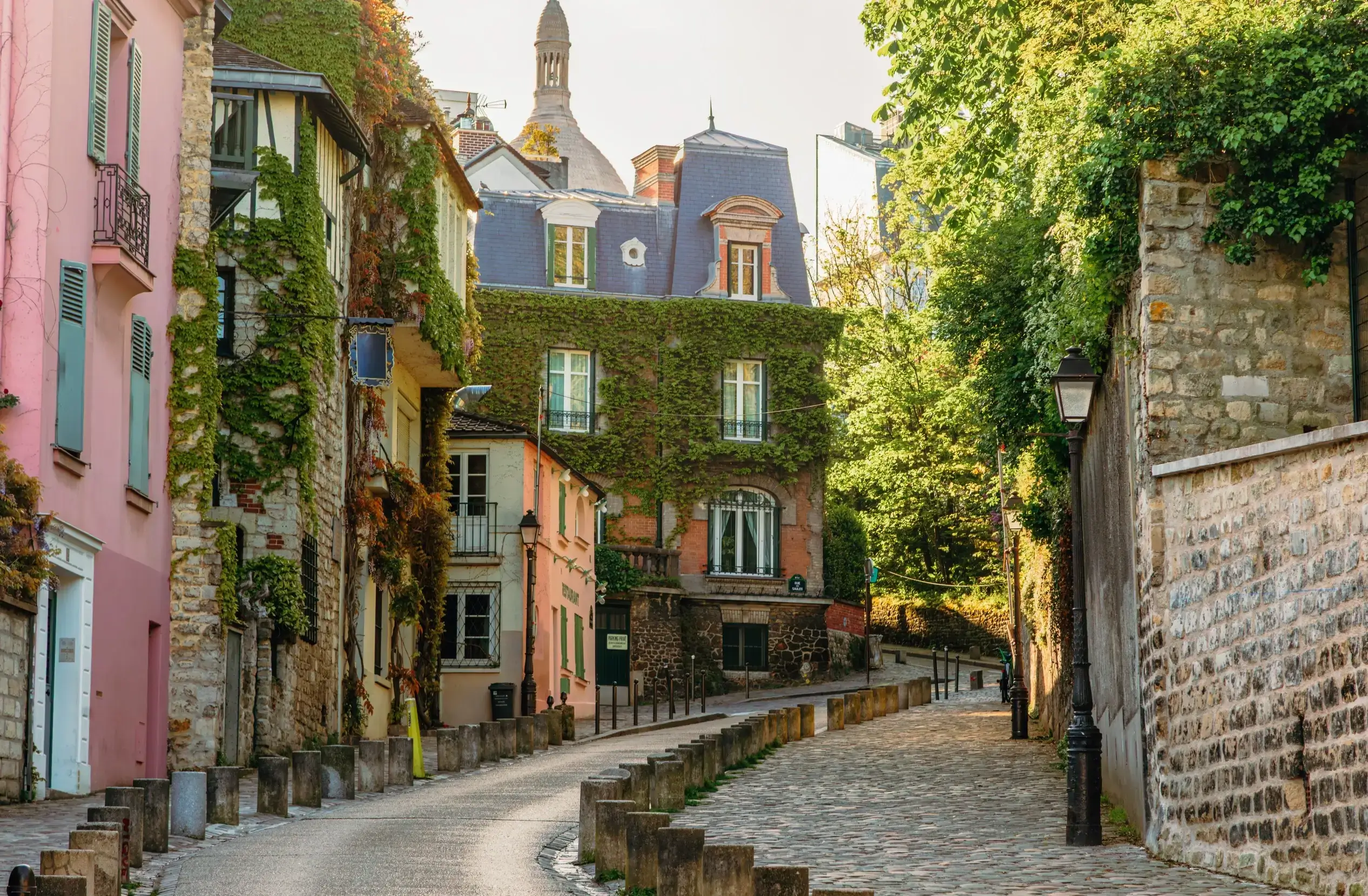 Charming cobblestone street lined with colorful buildings in Montmartre, Paris