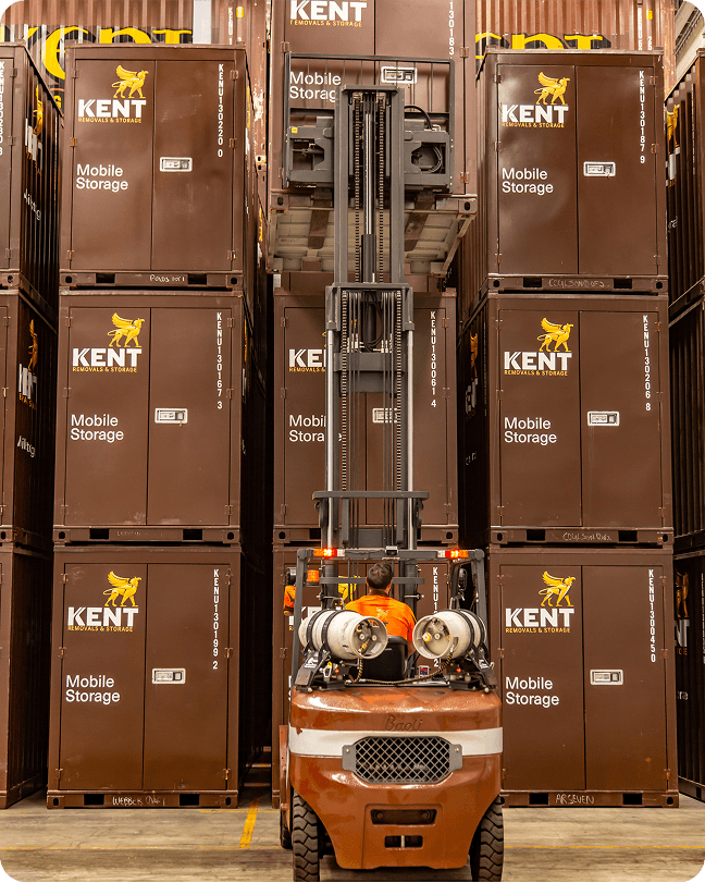 Kent Removals mobile storage containers stacked in secure warehouse facility
