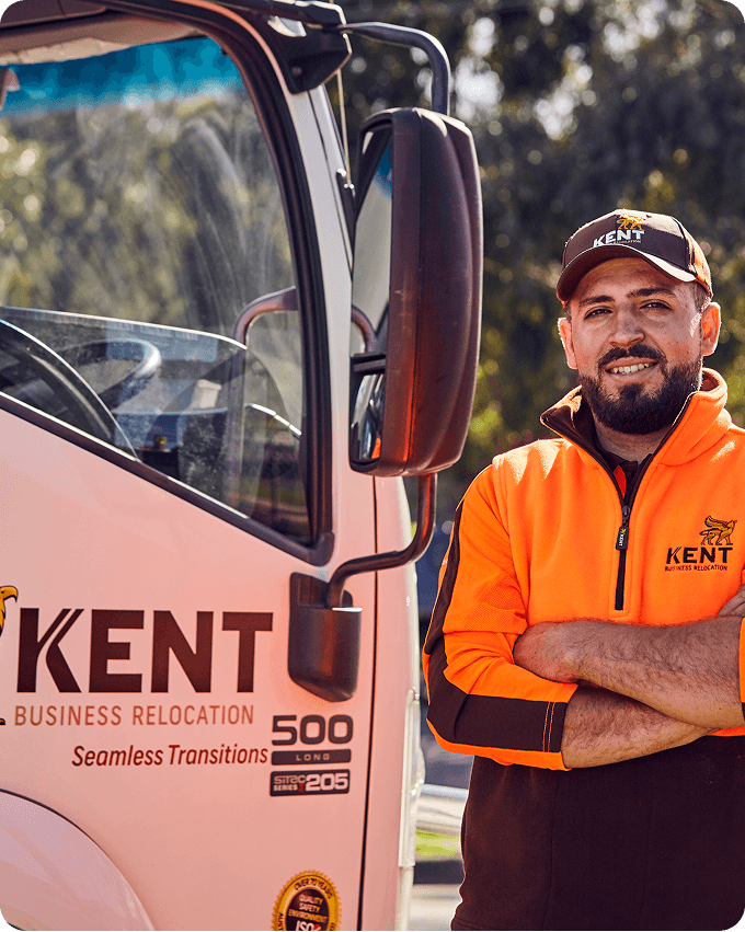 Kent Removals & Storage business relocation driver standing next to company moving truck
