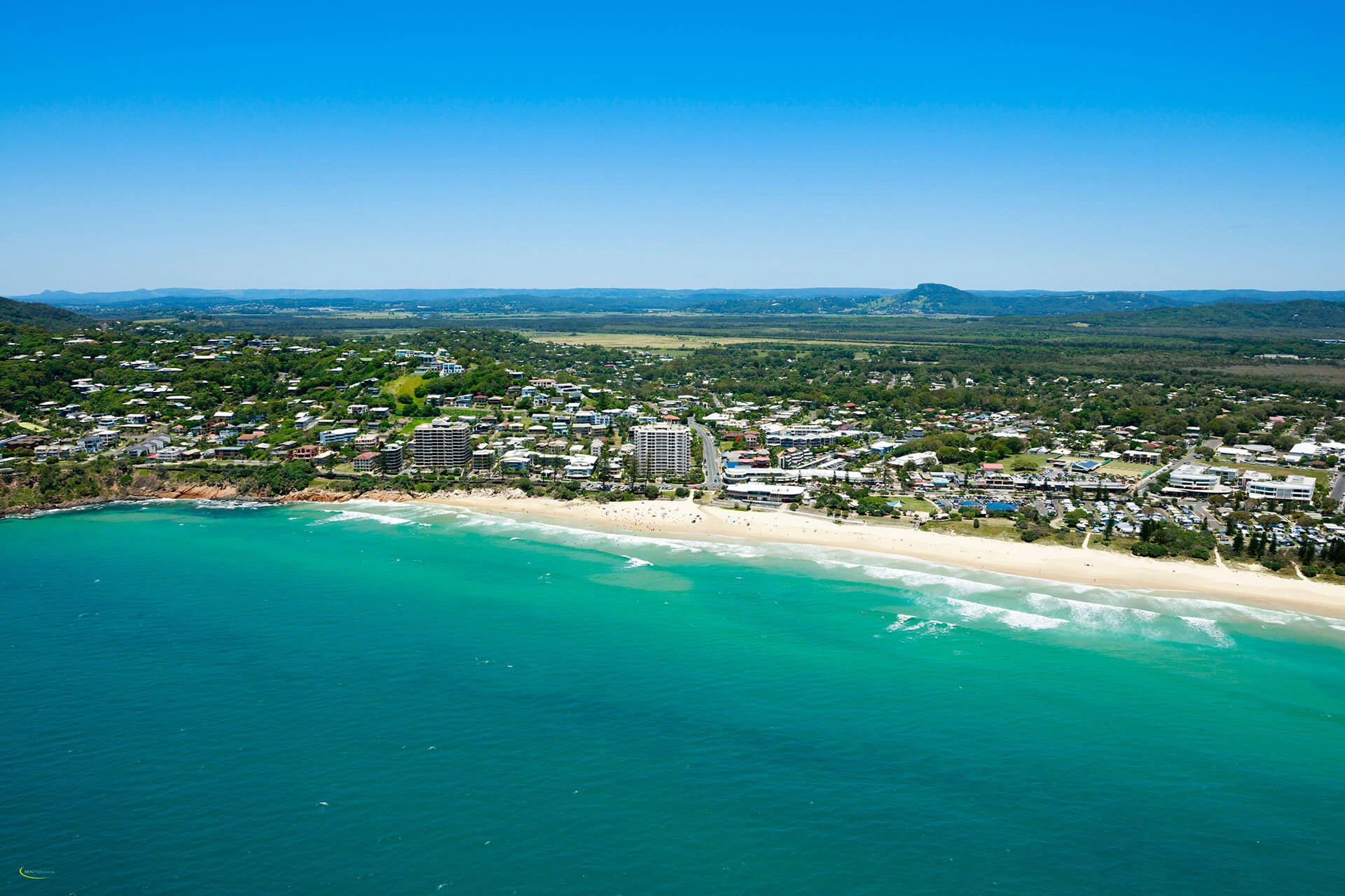 Aerial view of Coolum Beach coastline and township on Sunshine Coast