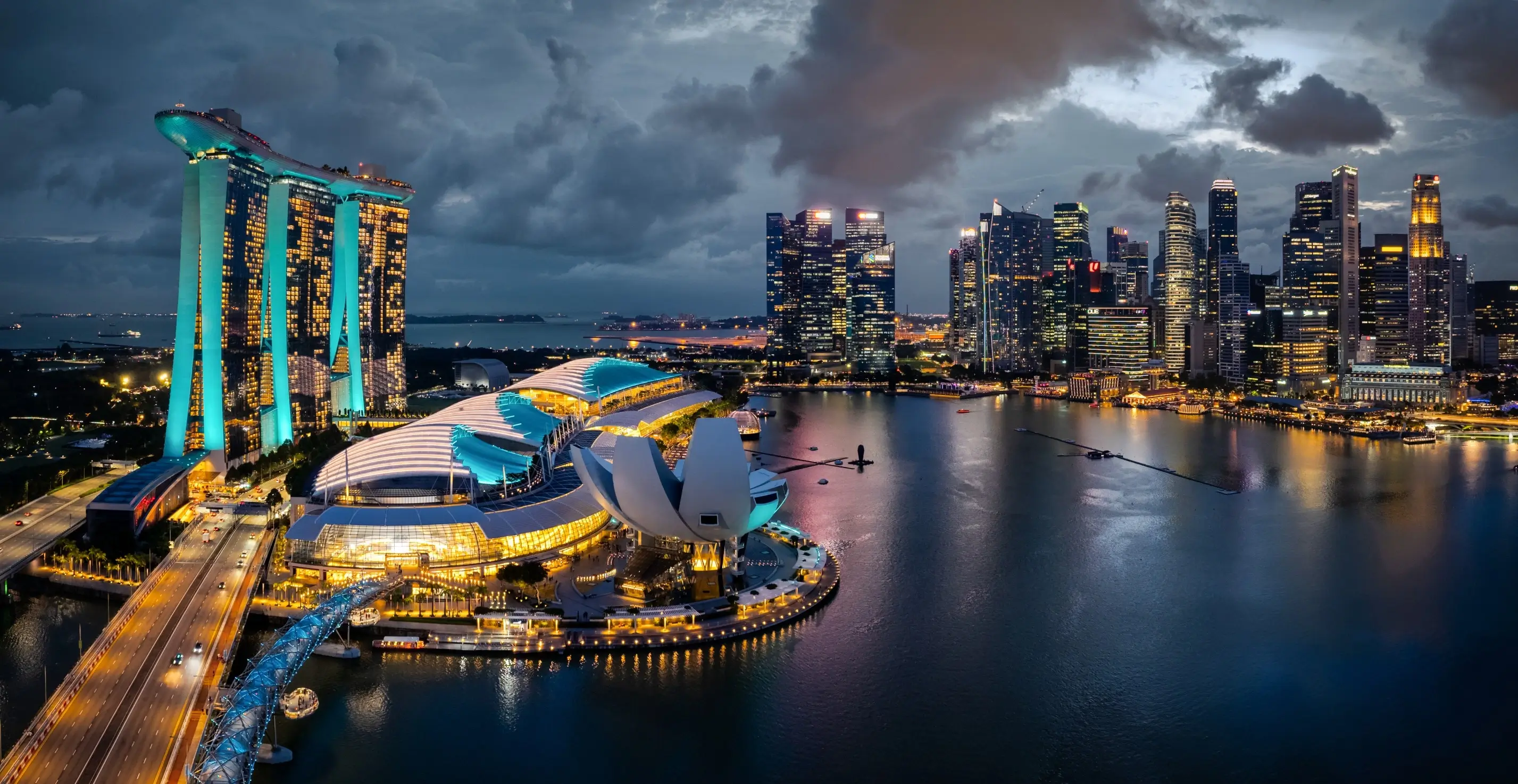 Aerial view of Singapore Marina Bay Sands and city skyline lit up at night