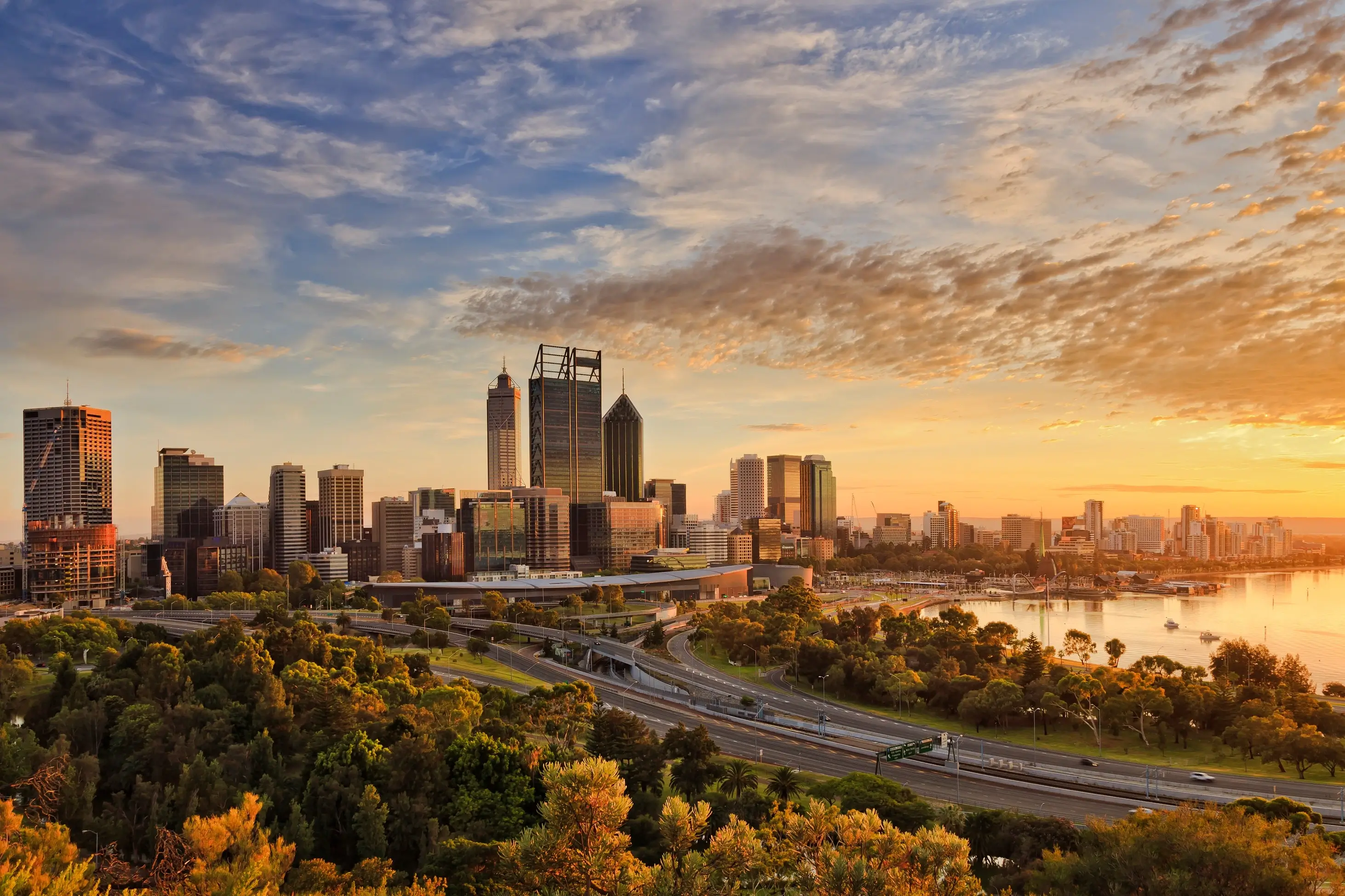 Perth city skyline at golden hour with Swan River